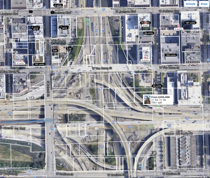  The Jane Byrne Interchange in the Greektown neighborhood of Chicago, with white boxes showing where buildings previously had been