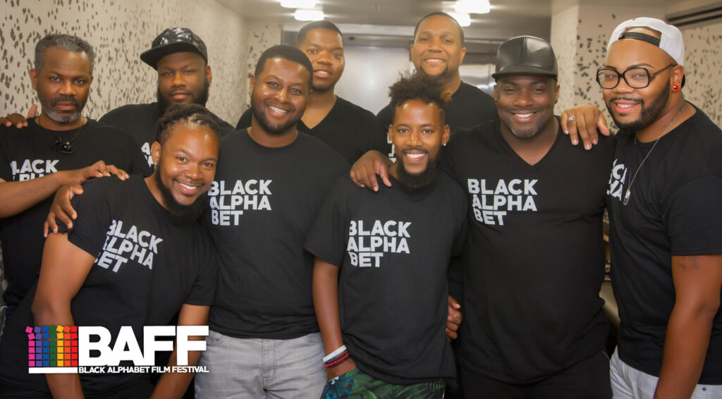9 members of BAFF posing in black BAFF t-shirts with Black Alphabet written in white letters 