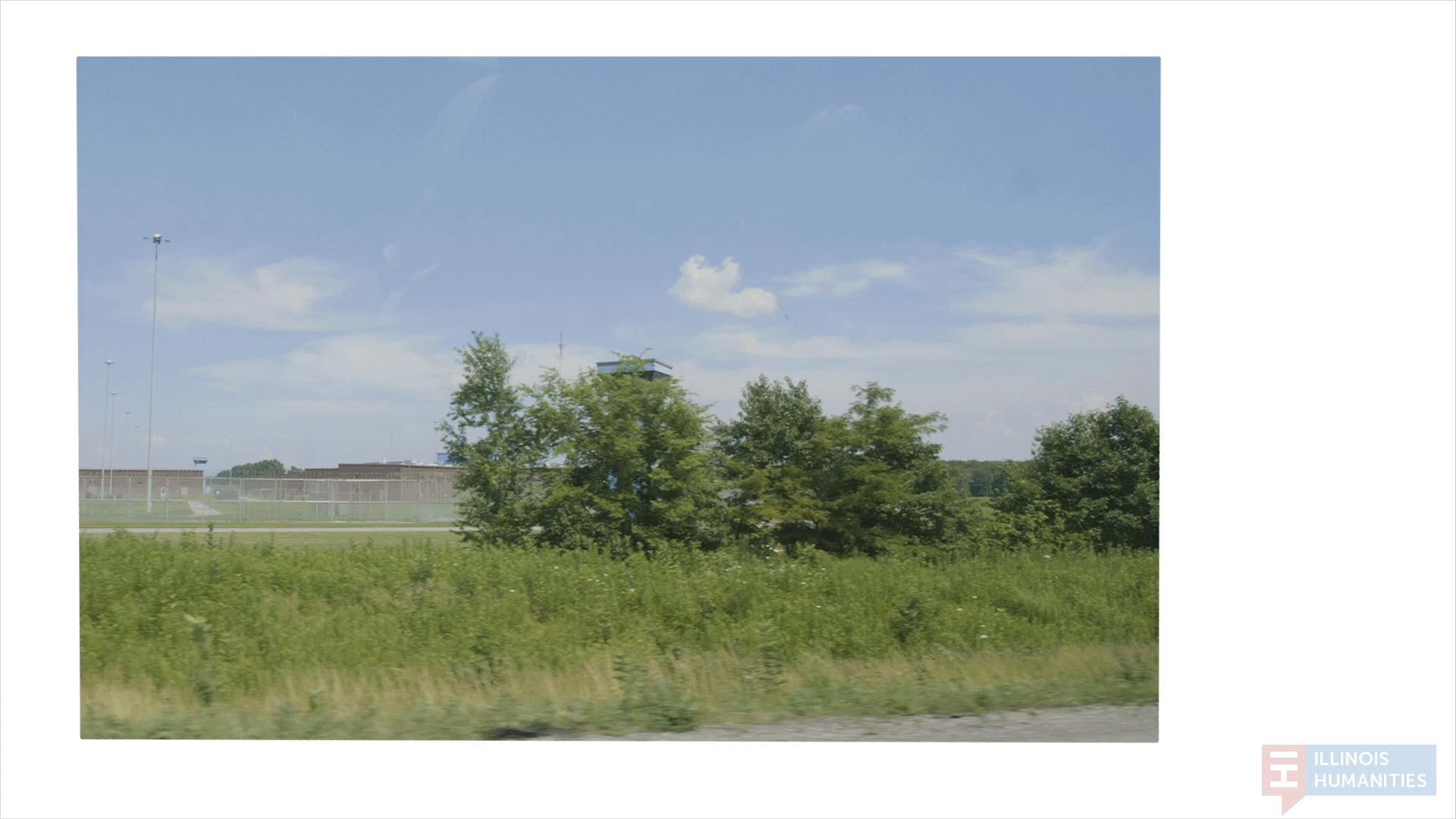 An animated gif of scenes from outside rural Illinois prisons, with green fields and barbed wires.