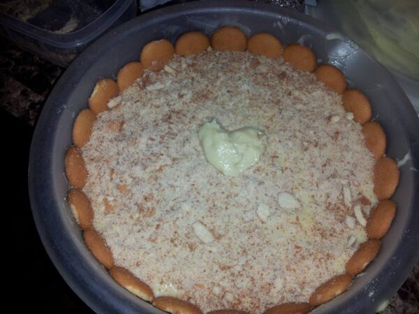 large bowl of banana pudding topped with NILLA Wafers instead of egg whites