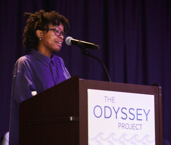 2023 Odyssey Project graduate speaking on stage