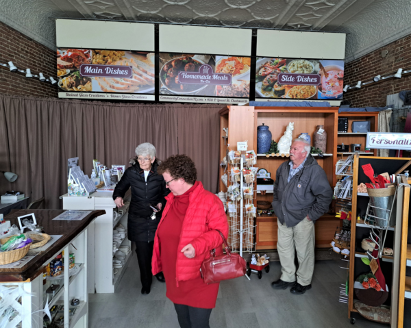 Mary Catherine Carter of Community Connection of Central Illinois and Fairbury Echoes Museum, left, Illinois Humanities consultant Deborah Fandrei of the Raupp Museum in Bufflao Grove, and local historian Dale Maley in the Community Connection Shoppe